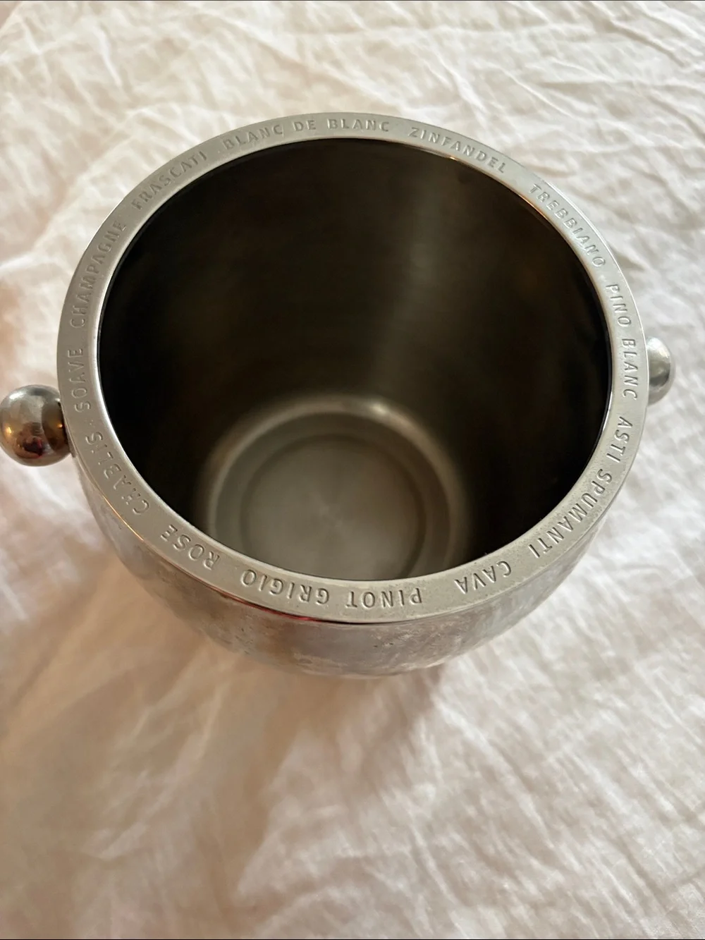 Williams Sonoma must stainless steel ice bucket. Names of wines around Rim.